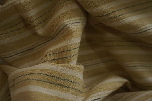 Fabric Material: 100% Organic yarn dyed Kala cotton fabric, Close-up of striped fabric with yellow and green lines