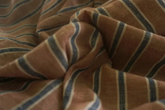 Close-up of striped fabric with brown and blue lines kala cotton fabric yarn dyed